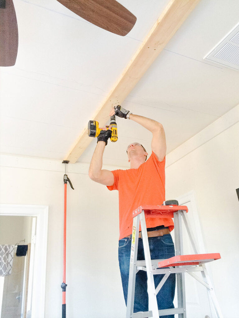 Use 5-inch screws to secure the supports to the ceiling