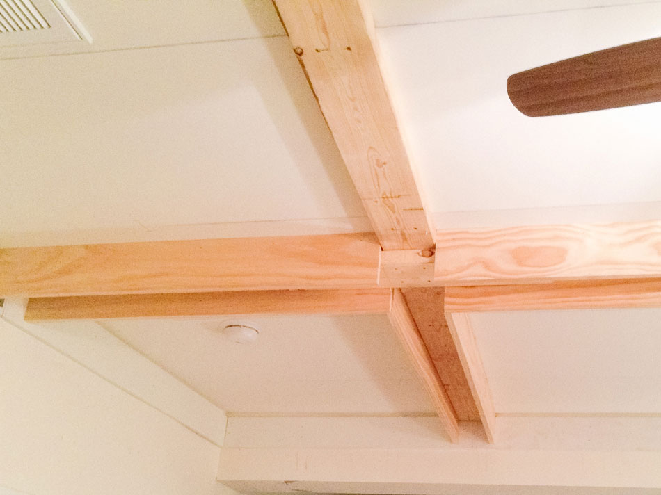 Securing the side trim to the ceiling supports