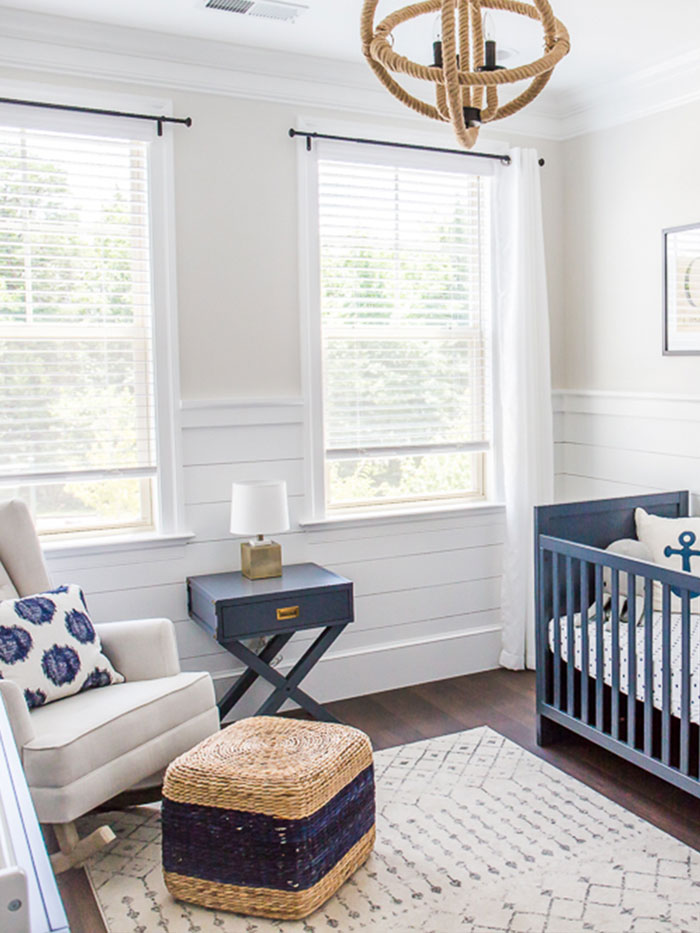The updated nautical nursery with new floors, trim, and decor