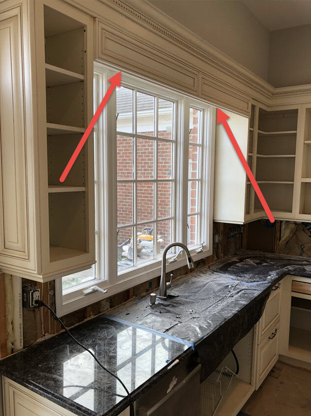 The extra piece of cabinet trim above the sink was removed to open the space up