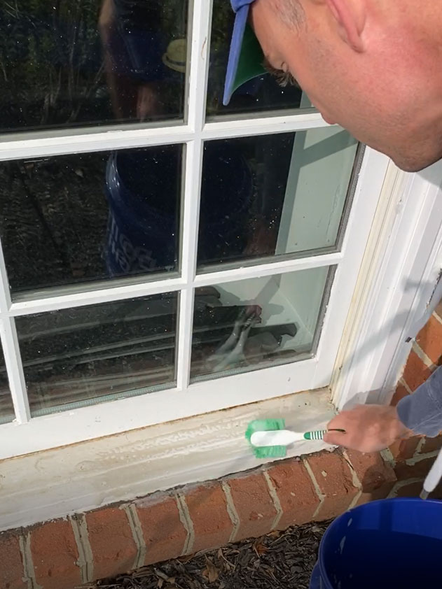 A dish scrubber makes a great tool to remove the dirt and grime from window sills. 