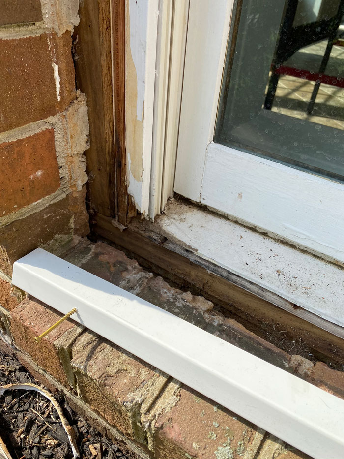 Use trim screws to securely fasten the apron to the sill. 