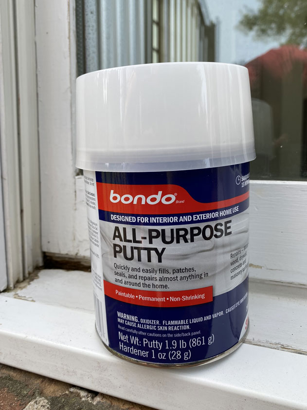 All-purpose Bondo putty can fill voids where wood rot occurred.  