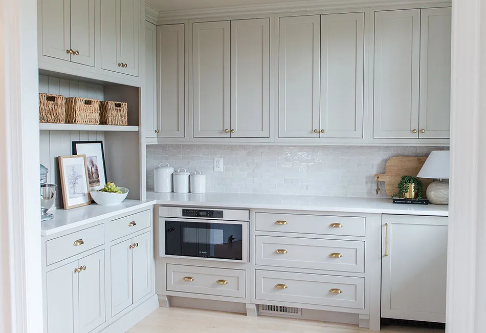 This custom pantry went from a dark, two pantry design to an open, light and bright custom walk in pantry!