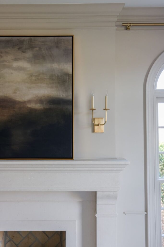 Double brass sconce in dining room