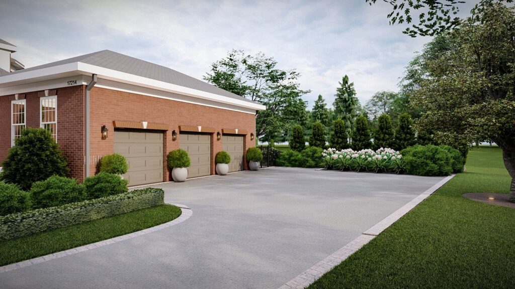 The garage doors of the Arched Manor with an updated landscape plan