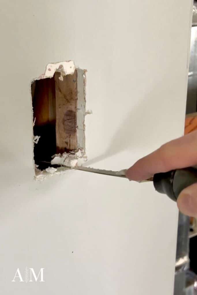 Cleaning drywall hole edges