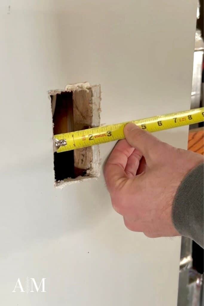 measure drywall hole