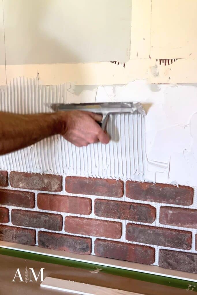 Use trowel to install brick wall