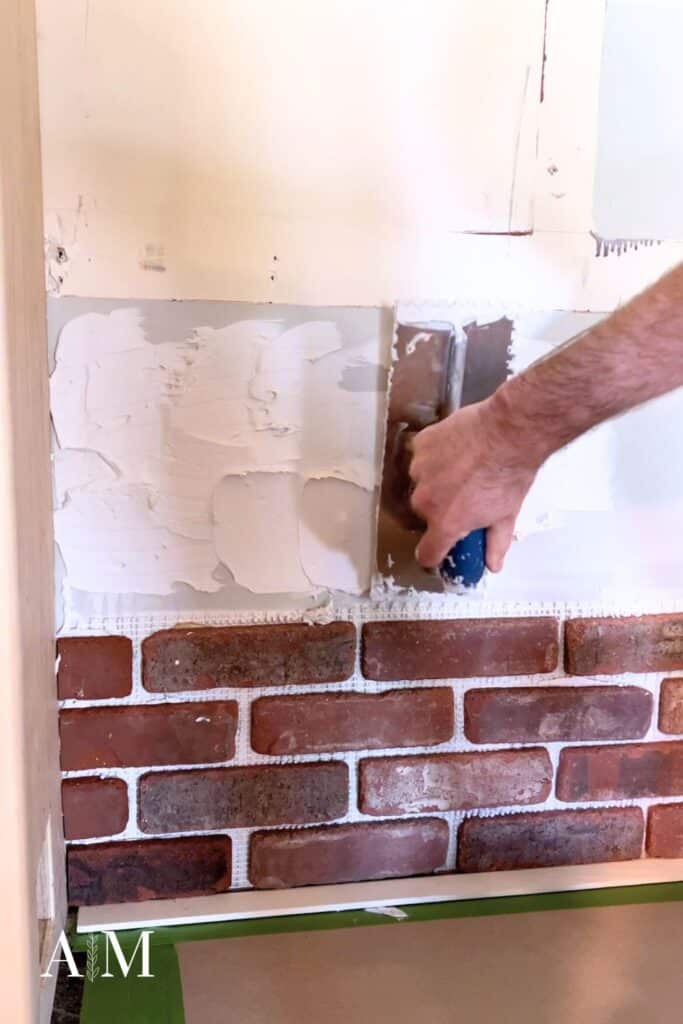 How to install brick wall - apply adhesive