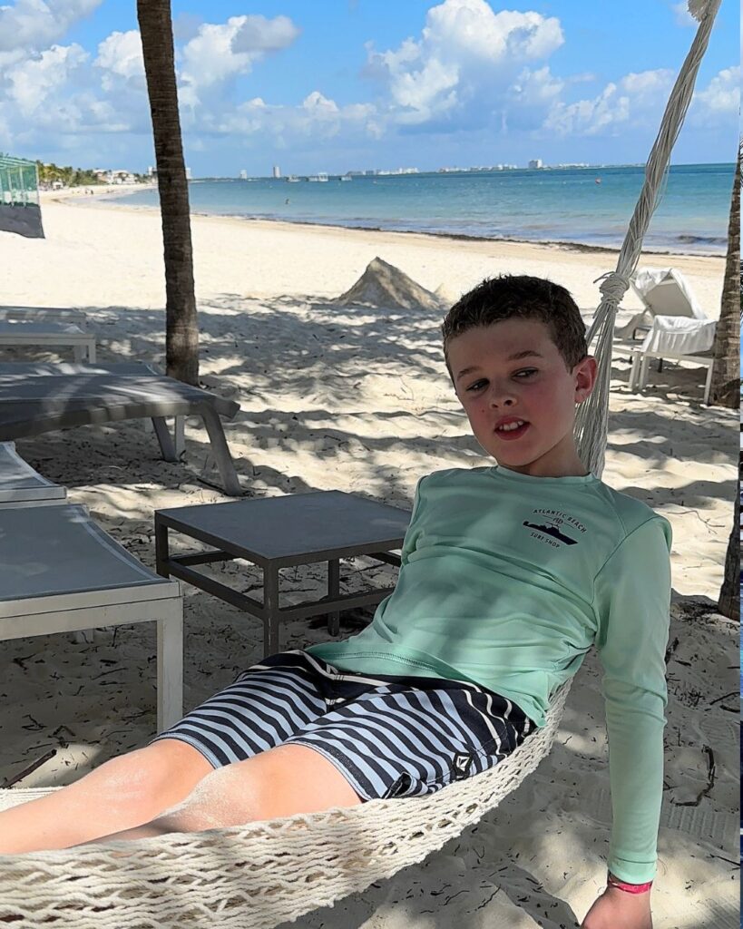 Tristan relaxing in the hammocks on the beach.