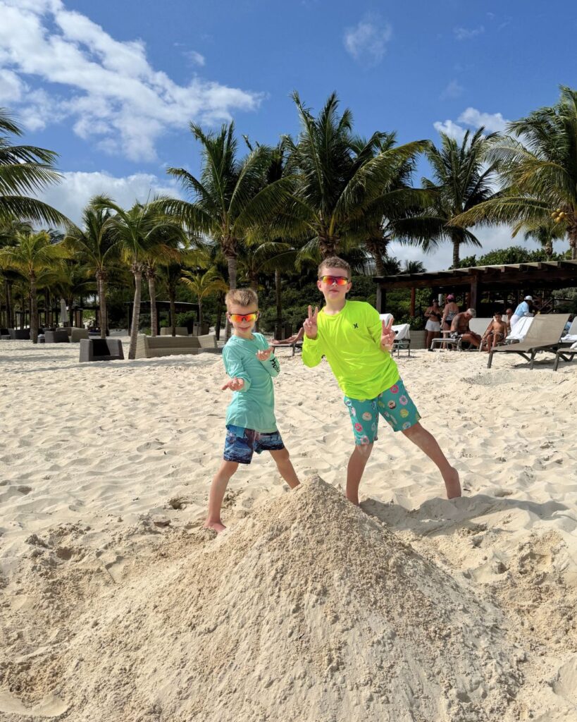 Who can build the biggest sandcastle at the beach? These kids.